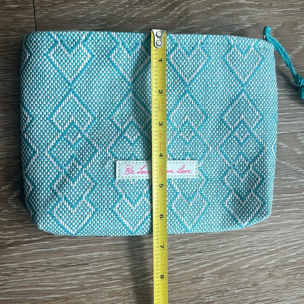 Josie Maran white/turquoise patterned woven cosmetic/makeup bag